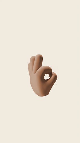 3D rendering of a brown hand showing the OK gesture on a beige background.